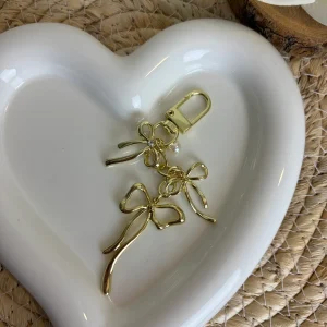 Gouden hanger met strikken